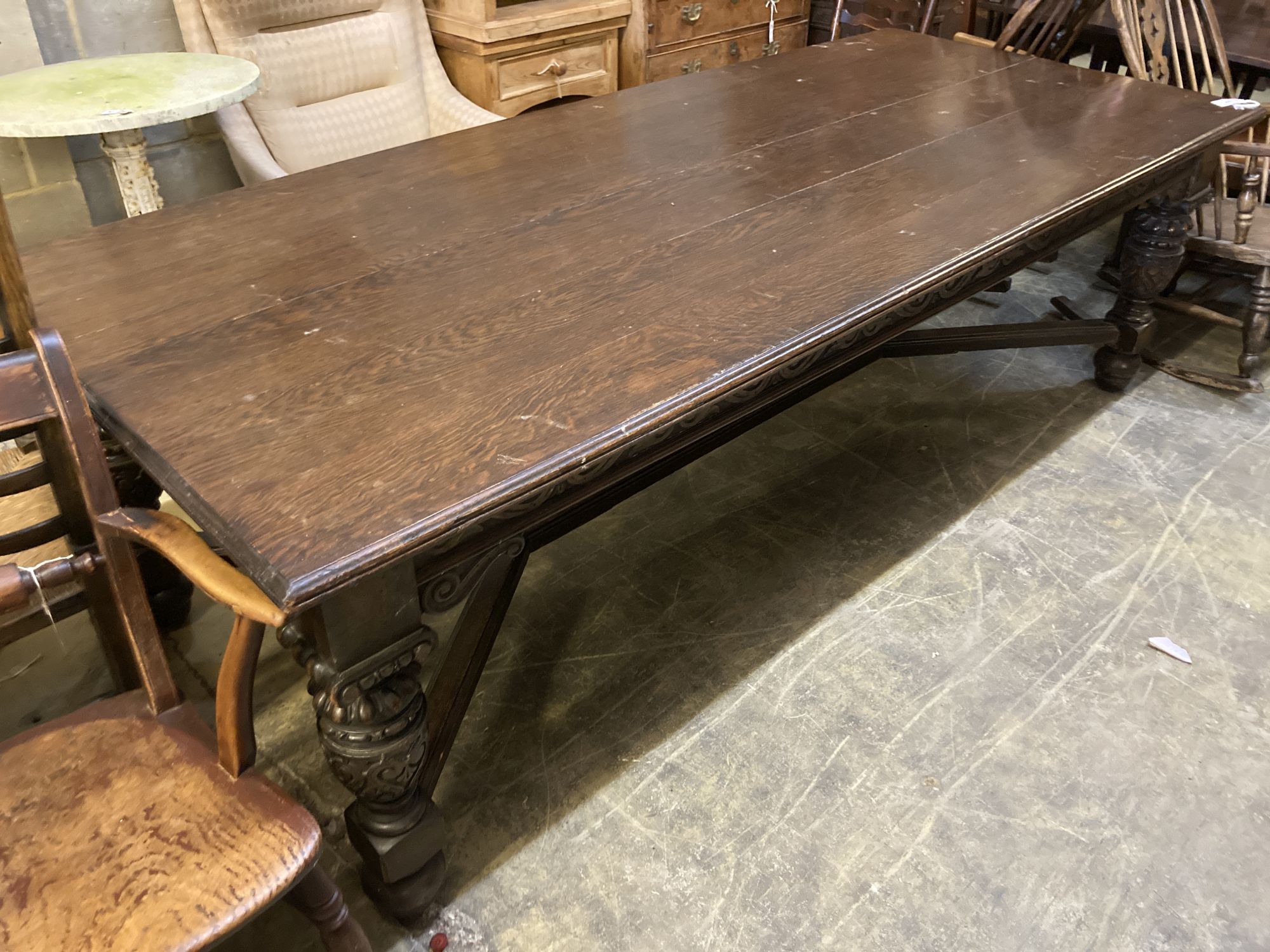 A Victorian oak refectory dining table, on carved bulbous legs, length 244cm, depth 104cm, height 74cm
